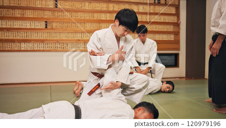 Karate, martial arts and self defense with students in dojo for demonstration, fitness or training. Challenge, grappling or technique with Sensei and people in Japan for combat, fighting or sports 120979196