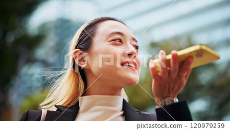 Phone call, loudspeaker and woman with conversation, outdoor and connection with employee. Japanese person, travel and girl in street, cellphone and recording with message to contact or digital app Phone call, loudspeaker and woman with conversation, outdoor and connection with employee. Japanese person, travel and girl in street, cellphone and recording with message to contact or digital app 120979259