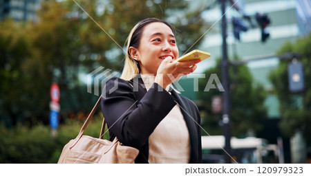 Business woman, speakerphone and travel in city with thinking, memo or networking for legal career. Person, phone call and corporate lawyer for voice notes, chat or happy on commute to work in Japan 120979323