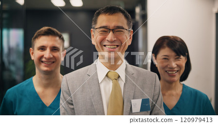 Portrait, doctors and business with Japanese man in hospital for leadership, teamwork and healthcare study. Medical, solidarity and smile with people and investor for partnership and consulting 120979413