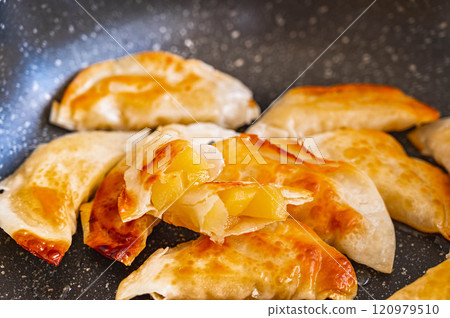 Deep fried dumplings, apple pie style 120979510