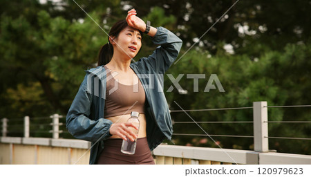 Japanese woman, tired and fitness in city for sports exercise, marathon training and workout practice. Athlete, fatigue and break of physical activity, cardio performance and wellness on Japan bridge Japanese woman, tired and fitness in city for sports exercise, marathon training and workout practice. Athlete, fatigue and break of physical activity, cardio performance and wellness on Japan bridge 120979623
