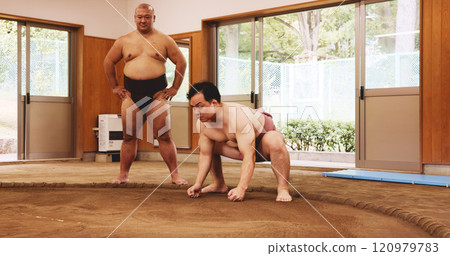 Men, fitness and exercise for sumo, training and stretching with preparation, balance and shiko in Japan. Japanese athlete, fighter and practice in dohyo for sports, workout or wrestling with warm up 120979783