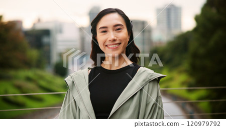 City, exercise and portrait of Japanese woman outdoor for cardio or marathon training routine. Bridge, fitness and smile of happy sports athlete or runner in Japan for challenge, health or wellness 120979792