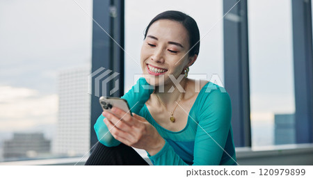 Phone, happy and Japanese woman in dance studio with networking, communication or browsing social media. Smile, cellphone and female ballerina watching online video for classic technique at rehearsal Phone, happy and Japanese woman in dance studio with networking, communication or browsing social media. Smile, cellphone and female ballerina watching online video for classic technique at rehearsal 120979899