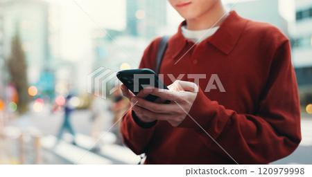 City, hands and person in street with phone, morning commute or typing on mobile app for online chat. Urban, travel and Japanese student on sidewalk with smartphone, social media post or connectivity City, hands and person in street with phone, morning commute or typing on mobile app for online chat. Urban, travel and Japanese student on sidewalk with smartphone, social media post or connectivity 120979998