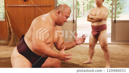 Japanese men, sumo wrestling and sport for training and practice in dohyo ring. Tradition, wrestlers and Asian people exercise for culture, martial arts and coaching student for teaching technique 120980031