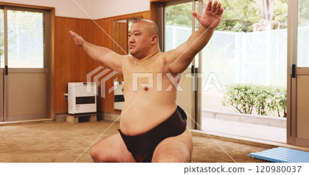Athlete, training and exercise for sumo, wrestler and fitness with preparation, skill and technique in ring. Japanese man, fighter and sports in dohyo for culture, workout and wrestling with warm up 120980037