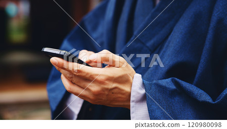 Japan, hands and man with smartphone, typing and internet with connection, social media and chatting. Person, kimono and guy with cellphone, mobile user and message to contact, texting and network 120980098