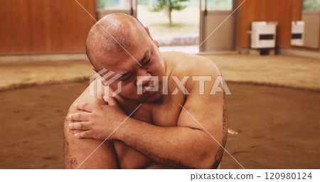 Man, wrestler and shoulder pain for sumo, fitness and exercise with injury, discomfort and tension. Male person, athlete and muscle inflammation for training, workout and sports with culture in Japan 120980124