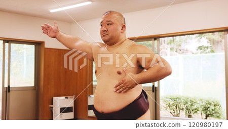 Athlete, training and exercise for sumo, sports and fitness with preparation, skill and wrestling in ring. Japanese man, fighter and wrestler in dohyo for culture, workout and technique with warm up Athlete, training and exercise for sumo, sports and fitness with preparation, skill and wrestling in ring. Japanese man, fighter and wrestler in dohyo for culture, workout and technique with warm up 120980197