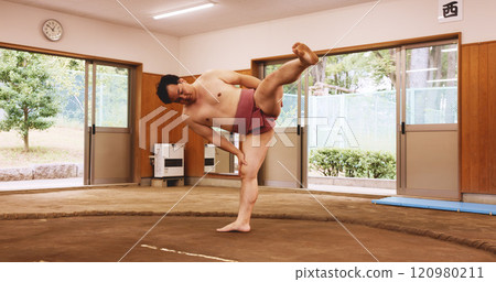 Sumo wrestler, stretching and man in studio, training and wellness with traditional sports. Japan, festival and person with competition, game and practice for skills, dohyo ring or culture with arena Sumo wrestler, stretching and man in studio, training and wellness with traditional sports. Japan, festival and person with competition, game and practice for skills, dohyo ring or culture with arena 120980211