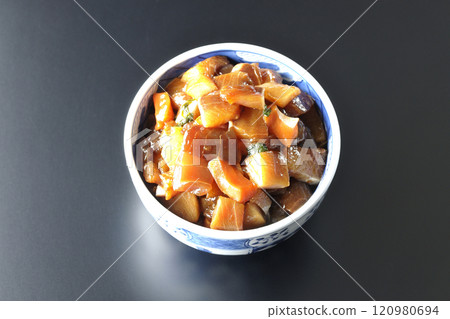 A luxurious, heaping bowl of pickled seafood photographed against a black background 120980694