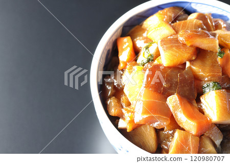 A luxurious, heaping bowl of pickled seafood photographed against a black background A luxurious, heaping bowl of pickled seafood photographed against a black background 120980707