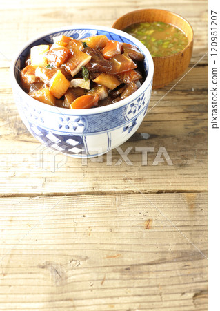 A luxurious, heaping bowl of pickled seafood with lots of ingredients and miso soup 120981207