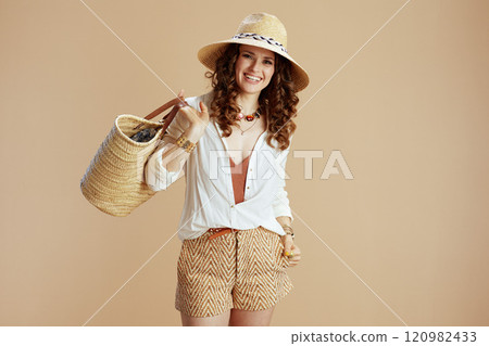 happy trendy housewife in blouse and shorts isolated on beige happy trendy housewife in blouse and shorts isolated on beige 120982433