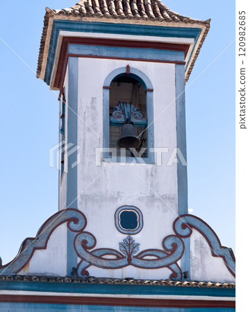 Traditional Blue and White Church Tower with Bell 120982685