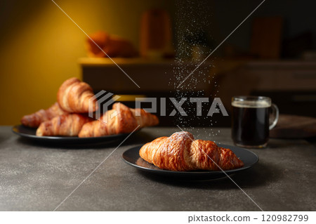 Croissants sprinkled with sugar powder. Croissants sprinkled with sugar powder. 120982799