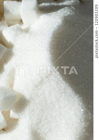 White refined beet sugar in the form of crystals and cubes. 120983289