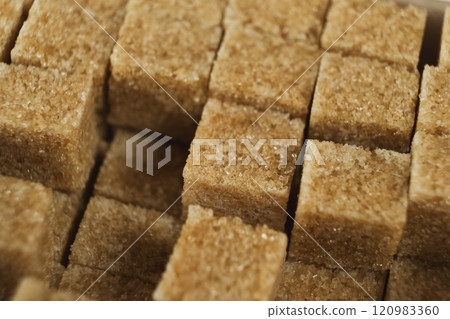 Macro cubes of brown cane unrefined demerara sugar. Macro cubes of brown cane unrefined demerara sugar. 120983360