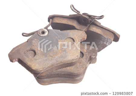 old used auto brake pads isolated on white background old used auto brake pads isolated on white background 120983807