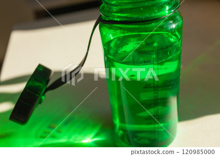 Water in a tritan bottle on the counter Water in a tritan bottle on the counter 120985000