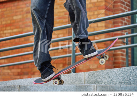 Skateboarder Performing Trick on Urban Street Skateboarder Performing Trick on Urban Street 120986134