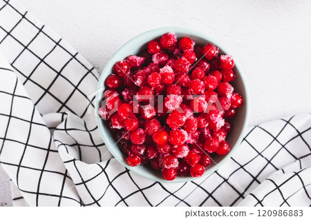 Frozen viburnum in a bowl  on the table top view 120986883