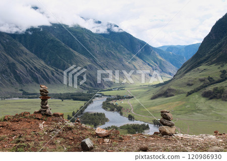 Stone pyramids, river valley. Natural landscape Altai, mountain in clouds 120986930