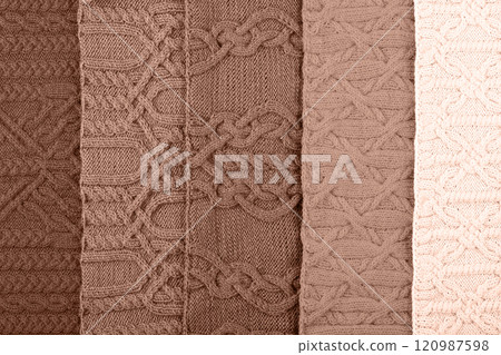 Demonstrating the colors of 2025 - Mocha Mousse. Knitted abstract background in different shades in trendy colors 2025. Large knitted blanket or sweater with pattern. Color concept. Demonstrating the colors of 2025 - Mocha Mousse. Knitted abstract background in different shades in trendy colors 2025. Large knitted blanket or sweater with pattern. Color concept. 120987598