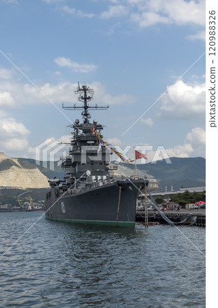 Novorossiysk, Russia - 18 August 2024 Cruiser Mikhail Kutuzov and dolphins, Black Sea, port, Krasnodar Territory, Novorossiysk. 120988326