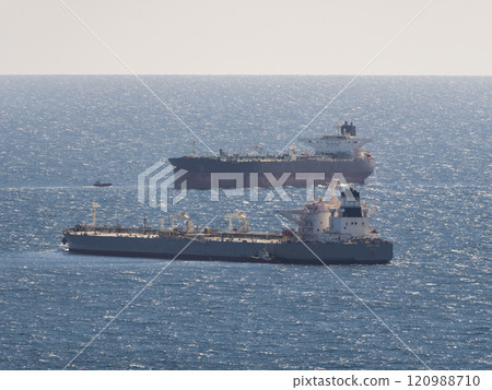Sea freighter sailing in the middle of the ocean with big waves 120988710