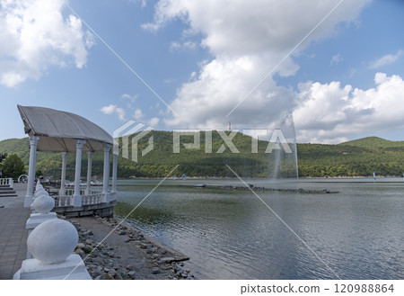 Abrau Durso, Russia 28 August 2024: Picturesque view of embankment of lake Abrau on sunny day in Abrau Durso Abrau Durso, Russia 28 August 2024: Picturesque view of embankment of lake Abrau on sunny day in Abrau Durso 120988864