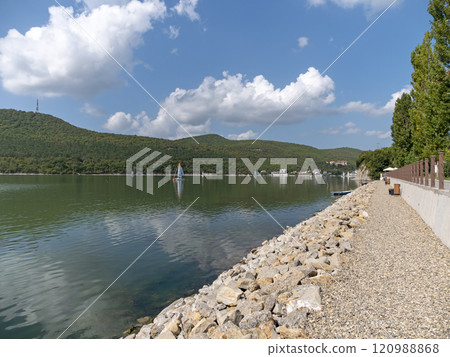 Abrau Durso, Russia 28 August 2024: Picturesque view of embankment of lake Abrau on sunny day in Abrau Durso 120988868