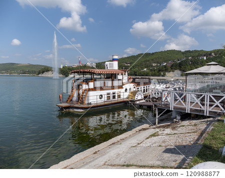 Abrau Durso, Russia 28 August 2024: The retro steamship Champagne is moored at the pier on the embankment of Lake Abrau-Durso Abrau Durso, Russia 28 August 2024: The retro steamship Champagne is moored at the pier on the embankment of Lake Abrau-Durso 120988877