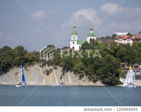 Abrau Durso, Russia 28 August 2024: Picturesque view of embankment of lake Abrau on sunny day in Abrau Durso 120988893