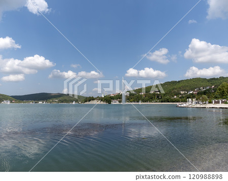 Abrau Durso, Russia 28 August 2024: Picturesque view of embankment of lake Abrau on sunny day in Abrau Durso Abrau Durso, Russia 28 August 2024: Picturesque view of embankment of lake Abrau on sunny day in Abrau Durso 120988898