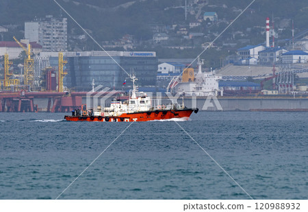 Novorossiysk, Russia - 18 August 2023. red port ship name Captain Fofonov in the port of Novorossiysk Black Sea Novorossiysk, Russia - 18 August 2023. red port ship name Captain Fofonov in the port of Novorossiysk Black Sea 120988932