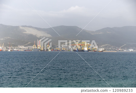 Sea freighter sailing in the middle of the ocean with big waves Sea freighter sailing in the middle of the ocean with big waves 120989233