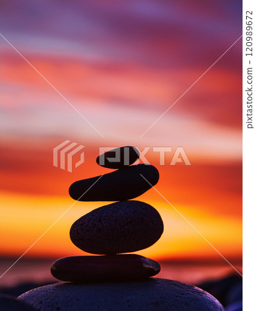 Zen Stones with Vibrant Sunset 120989672