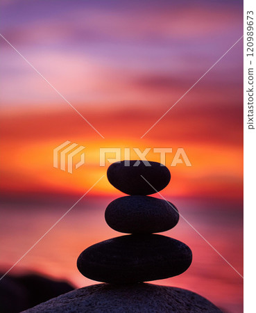 Zen Stones with Vibrant Sunset 120989673
