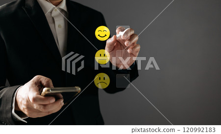 a businessman choose the virtual screen on the happy smile face icon to give satisfaction in service.rating very impressed.customer review service and Satisfaction concept a businessman choose the virtual screen on the happy smile face icon to give satisfaction in service.rating very impressed.customer review service and Satisfaction concept 120992183