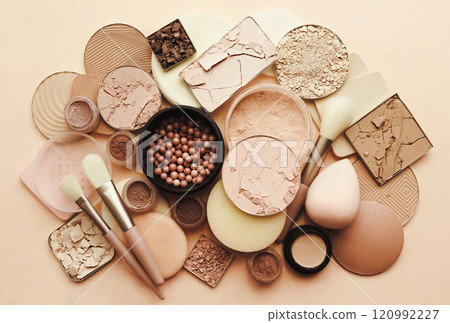 Varieties of face powders and foundations for perfect complexion, basic make up products to even out and matte skin, beauty cosmetics with brushes and sponges, selective focus Varieties of face powders and foundations for perfect complexion, basic make up products to even out and matte skin, beauty cosmetics with brushes and sponges, selective focus 120992227