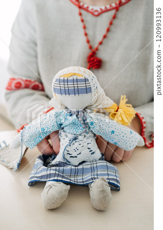 Traditional handmade Slavic doll with intricate embroidery. Revival of cultural heritage and ethnic crafts, representing folk art traditions and artisanal creativity. Traditional handmade Slavic doll with intricate embroidery. Revival of cultural heritage and ethnic crafts, representing folk art traditions and artisanal creativity. 120993136