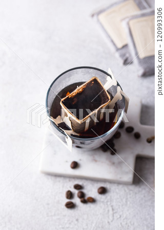 Freshly brewed drip coffee in glass cup Freshly brewed drip coffee in glass cup 120993306