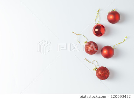 red Christmas balls on a white background red Christmas balls on a white background 120993452