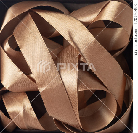 background with mocha mousse satin ribbon 120993498
