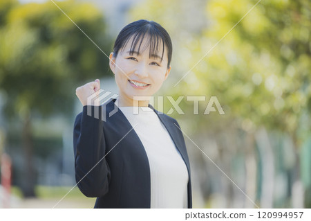 Portrait of a young woman in a suit 120994957
