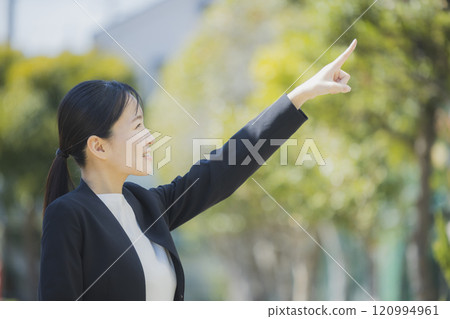Portrait of a young woman in a suit 120994961