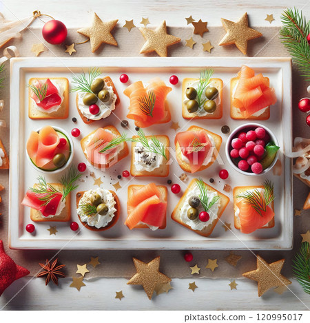 Festive salmon canapes on a white platter, garnished with herbs and berries 120995017